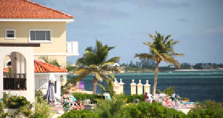 View of the grounds and the Caribbean, with one of the condo buildings in the background.