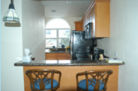 Fully-equipped kitchens, with breakfast nook and all amenities including dishes, pots, pans, and dishwasher. To prepare a gourmet meal, all that's missing is your food!