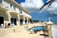 The seaside pool and sundeck off the beachfront condos -- one of two pools and decks at Turtle Nest Inn & Condos, Grand Cayman (TNI Photo)