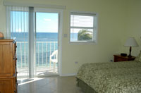 Superb views of the Caribbean from the master bedroom and balcony of a beachfront condo  (TNI Photo)
