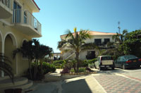 The beachfront condo building (left), the original Inn building, and the Caribbean beyond -- as seen from the second bedroom of an ocean view condo (TNI Photo)