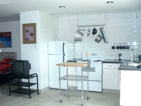 A fully-equipped kitchen at the Cottage, plus your own washer and dryer.